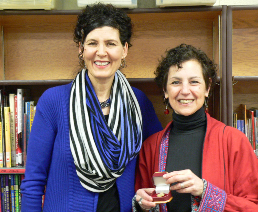 Ellen Schwartz receiving the 2013 Rocky Mountain Gold Medal from Co-Chair Michelle Dimnik for her novel The Case of the Missing Deed